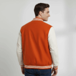 Varsity Vogue Letterman: Orange Varsity Jacket with White sleeves Varsity Vogue